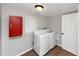 Functional laundry room, complete with washer, dryer, and storage at 2343 Carver Nw Dr, Atlanta, GA 30314