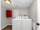 Laundry room with washer, dryer, and extra storage cabinet at 2343 Carver Nw Dr, Atlanta, GA 30314