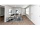Spacious living room featuring a gray sectional sofa and large windows at 2343 Carver Nw Dr, Atlanta, GA 30314