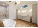 Elegant bathroom with marble shower, freestanding tub, and dual vanities at 954 Carl Sanders Dr, Acworth, GA 30101
