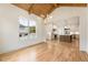 Bright dining room with hardwood floors and view into kitchen area at 954 Carl Sanders Dr, Acworth, GA 30101