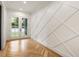 Bright entry with herringbone floors and a modern geometric wall at 954 Carl Sanders Dr, Acworth, GA 30101