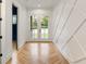 Bright entry with herringbone floors and a modern geometric wall at 954 Carl Sanders Dr, Acworth, GA 30101