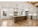 Modern kitchen with white cabinets, large island, and high-end appliances at 954 Carl Sanders Dr, Acworth, GA 30101