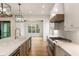 Modern kitchen features white cabinets, marble countertops, and a large island at 954 Carl Sanders Dr, Acworth, GA 30101