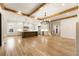 Open floor plan boasts a spacious kitchen, large island, and Gathering room with fireplace and access to outdoor patio at 954 Carl Sanders Dr, Acworth, GA 30101