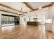 Open concept kitchen and Gathering room with hardwood floors, island, and sliding glass doors to patio at 954 Carl Sanders Dr, Acworth, GA 30101