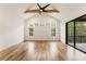 Spacious main bedroom with hardwood floors, vaulted ceiling, multiple windows, and access to patio at 954 Carl Sanders Dr, Acworth, GA 30101