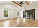 Main bedroom with hardwood floors, vaulted ceiling, sliding glass doors to patio, and fireplace at 954 Carl Sanders Dr, Acworth, GA 30101