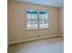 Bedroom with neutral colored walls, a window, and carpeted floors at 110 Fox Meadow Dr, Covington, GA 30016