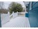 A side view of the deck with white railings and a vibrant blue siding creates a welcoming outdoor space at 110 Fox Meadow Dr, Covington, GA 30016