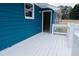 White wood deck against a backdrop of blue siding provides a relaxing outdoor area at 110 Fox Meadow Dr, Covington, GA 30016