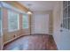 Cozy dining room with hardwood floors, three windows, and a closet at 110 Fox Meadow Dr, Covington, GA 30016