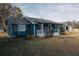 Side view of a charming blue house with white porch at 110 Fox Meadow Dr, Covington, GA 30016