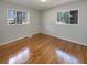 Bright bedroom with hardwood floors and two windows at 2565 Bonnybrook Sw Dr, Atlanta, GA 30311