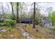 A verdant backyard featuring manicured landscaping and stone pathways leading to the charming home at 2597 Elsinore St, East Point, GA 30344