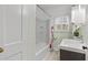 Bright bathroom featuring a shower-tub combo and stylish sink with decorative accents at 2597 Elsinore St, East Point, GA 30344