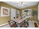 Dining room with rustic table, modern chairs, and unique wall art at 2597 Elsinore St, East Point, GA 30344