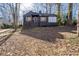 House exterior showcasing a dark painted brick home with a manicured lawn at 2597 Elsinore St, East Point, GA 30344