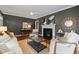 Cozy living room featuring a fireplace, ceiling fan, and modern decor at 2597 Elsinore St, East Point, GA 30344
