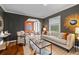 Comfortable living room with hardwood floors, stylish furniture, and a view into the next room at 2597 Elsinore St, East Point, GA 30344