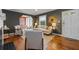 Cozy living room featuring hardwood floors, neutral-toned furniture, and an open doorway at 2597 Elsinore St, East Point, GA 30344