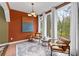 Bright sun room with large windows, stylish furniture, and lots of natural light at 2597 Elsinore St, East Point, GA 30344
