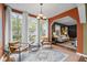 Bright sun room with large windows, stylish furniture, and lots of natural light at 2597 Elsinore St, East Point, GA 30344