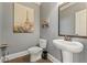 Small bathroom with pedestal sink, toilet, and framed mirror at 2671 Willow Field Se Xing # 14, Marietta, GA 30067