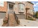 Brick front exterior of townhome with 2-car garage and staircase at 2671 Willow Field Se Xing # 14, Marietta, GA 30067