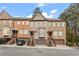 Three townhouses with brick fronts, garages, and landscaping at 2671 Willow Field Se Xing # 14, Marietta, GA 30067