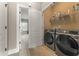 Convenient laundry room with washer, dryer, and shelving at 2671 Willow Field Se Xing # 14, Marietta, GA 30067