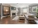 Living room features hardwood floors, a fireplace, and large windows at 2671 Willow Field Se Xing # 14, Marietta, GA 30067