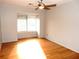 Simple bedroom with hardwood floors and ceiling fan at 2058 Powers Ferry Se Trce, Marietta, GA 30067