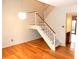 Light dining area with hardwood floors and a modern staircase at 2058 Powers Ferry Se Trce, Marietta, GA 30067