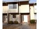 Tan siding townhouse with brick accents, and a well-maintained front yard at 2058 Powers Ferry Se Trce, Marietta, GA 30067
