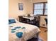 Cozy bedroom featuring natural light, wood floors and a full sized bed at 40 Chimney Rise Ct, Stockbridge, GA 30281