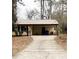 Residential home featuring a driveway leading to the front entrance and a well-kept lawn at 40 Chimney Rise Ct, Stockbridge, GA 30281
