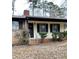 Charming home with a brick and siding exterior, covered front porch, and well-maintained landscaping at 40 Chimney Rise Ct, Stockbridge, GA 30281