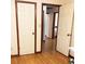 Hallway showing hardwood floors and multiple doors, with one leading to a bedroom at 40 Chimney Rise Ct, Stockbridge, GA 30281