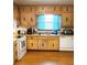 Classic kitchen with wood cabinets, white appliances, and natural lighting at 40 Chimney Rise Ct, Stockbridge, GA 30281