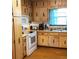 Cozy kitchen with wood cabinets and white appliances at 40 Chimney Rise Ct, Stockbridge, GA 30281