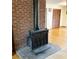 Cozy living room features a vintage-style fireplace and hardwood floors at 40 Chimney Rise Ct, Stockbridge, GA 30281