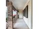 Covered porch showing brick columns and a view of the yard at 40 Chimney Rise Ct, Stockbridge, GA 30281