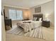 Cozy bedroom with a queen bed, dresser, and large window at 224 Seasons Pkwy, Norcross, GA 30093