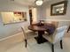 Dining room with a round table, four chairs, and a pass-through kitchen counter at 224 Seasons Pkwy, Norcross, GA 30093