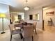 Bright dining room with a round table and four chairs, looking toward living room at 224 Seasons Pkwy, Norcross, GA 30093