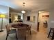 Bright dining room with a round table and four chairs, looking toward living room at 224 Seasons Pkwy, Norcross, GA 30093
