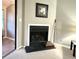 Cozy corner fireplace with a black hearth in living room at 224 Seasons Pkwy, Norcross, GA 30093