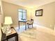 Spacious home office with a desk, chair, and natural light at 224 Seasons Pkwy, Norcross, GA 30093
